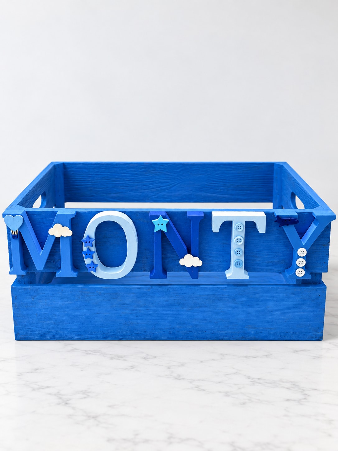 Personalised name crate filled with roses and seasonal blooms